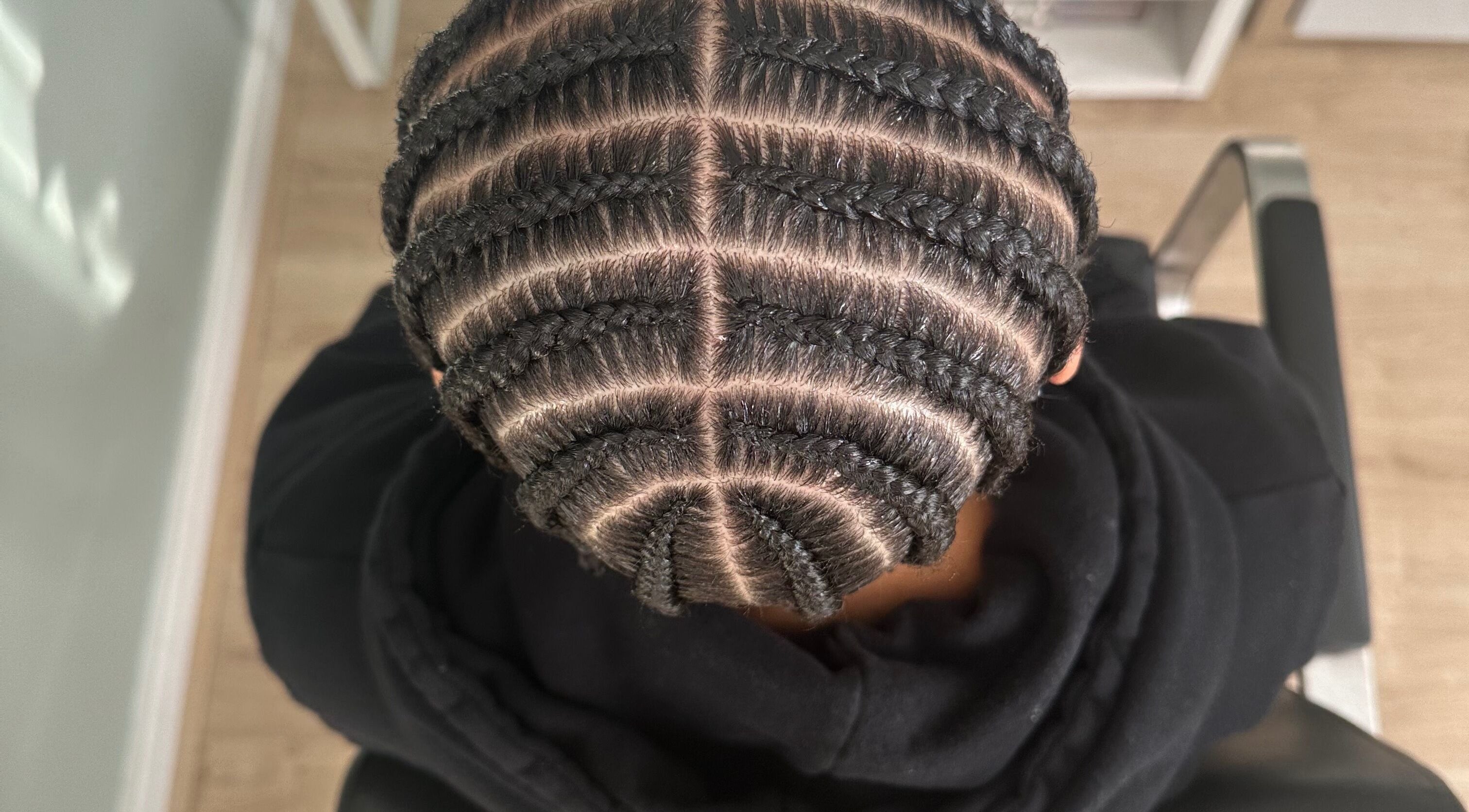 Detailed braid design at Hair Me Out in Dagenham, England, GB, showcasing elegant hair artistry.