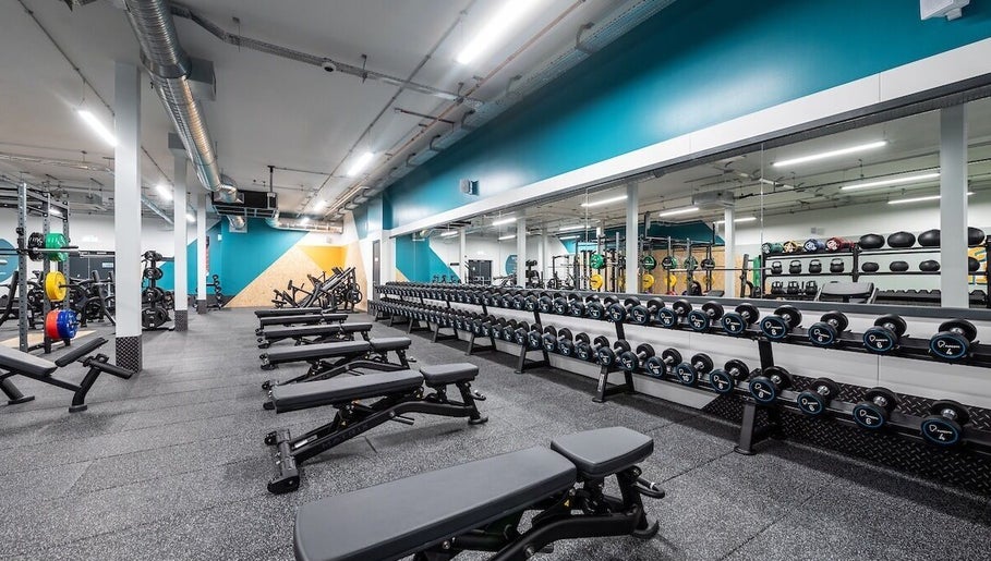 Modern gym with weights and benches at Iron Minds Coaching, Letchworth Garden City, England, GB.