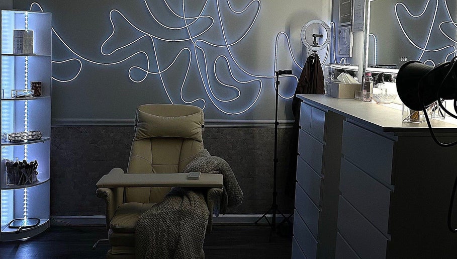 Modern beauty room at Luxe by Lia, featuring ambient lighting and plush chair in Atlanta, Georgia, US.