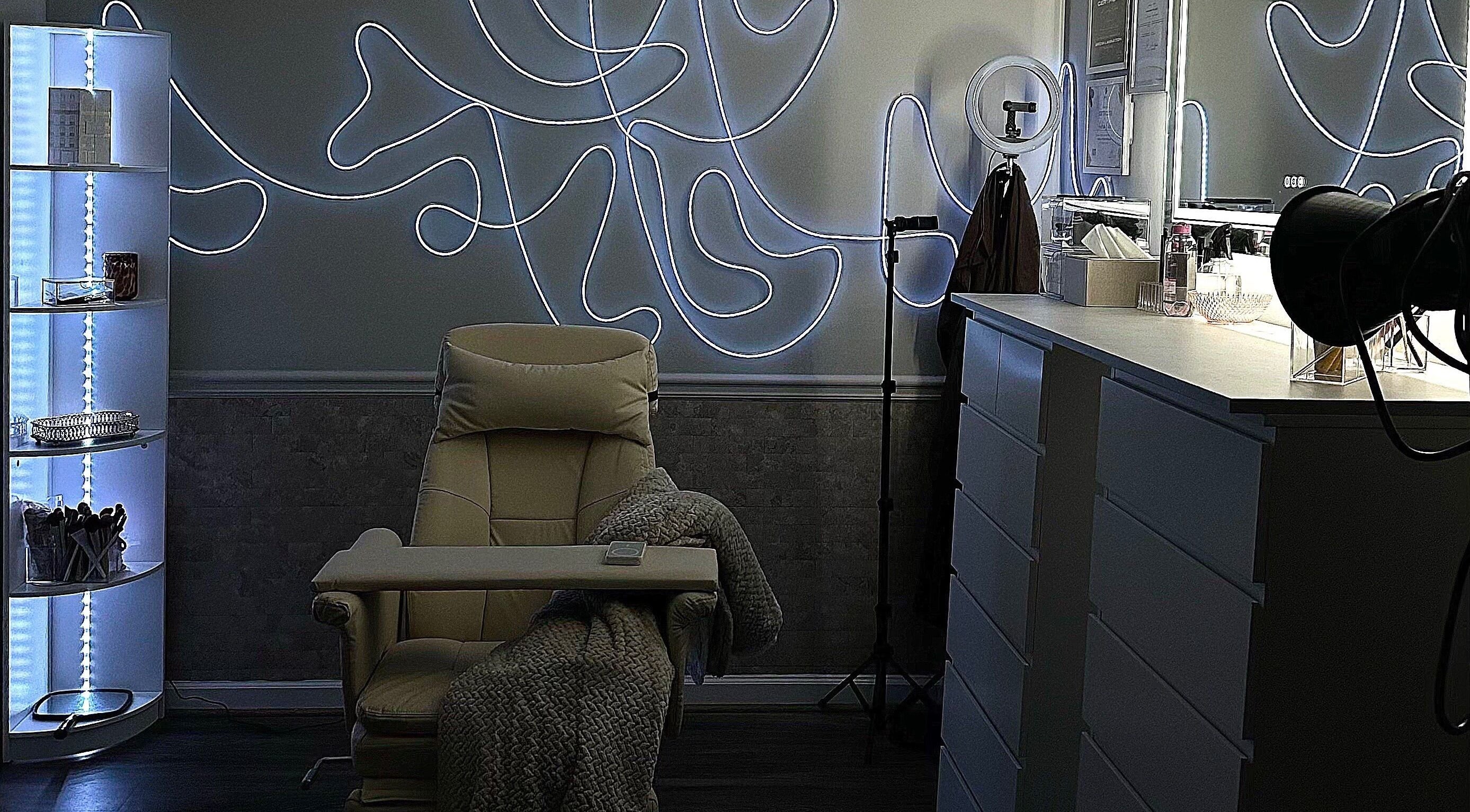 Modern beauty room at Luxe by Lia, featuring ambient lighting and plush chair in Atlanta, Georgia, US.