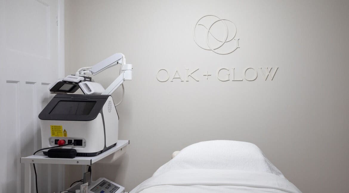 Modern treatment room at Oak + Glow in Chaldon, England, GB, featuring advanced beauty equipment.