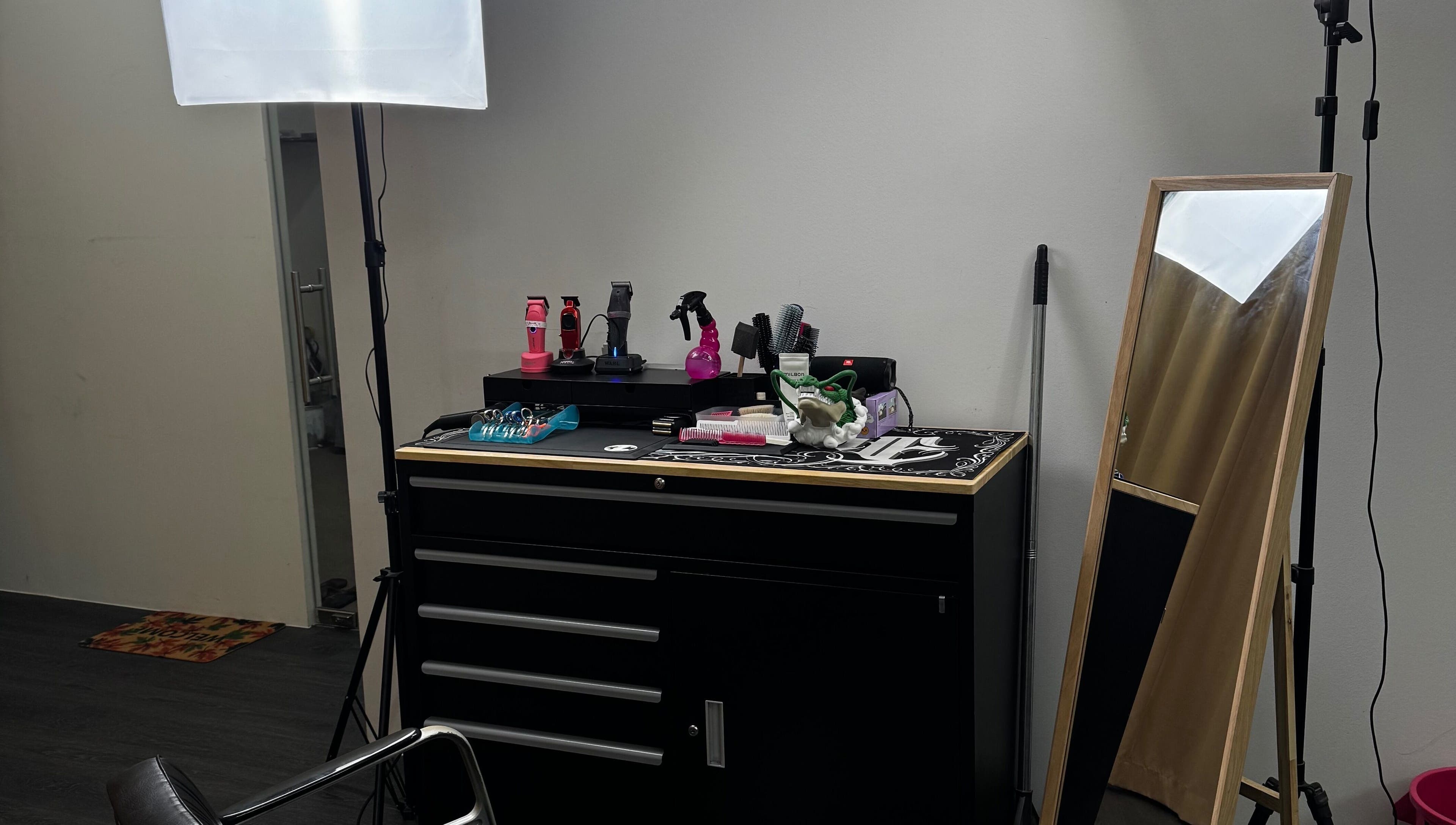 Rascals hair styling station in Singapore, Singapore, SG, featuring tools and a mirror for hair services.