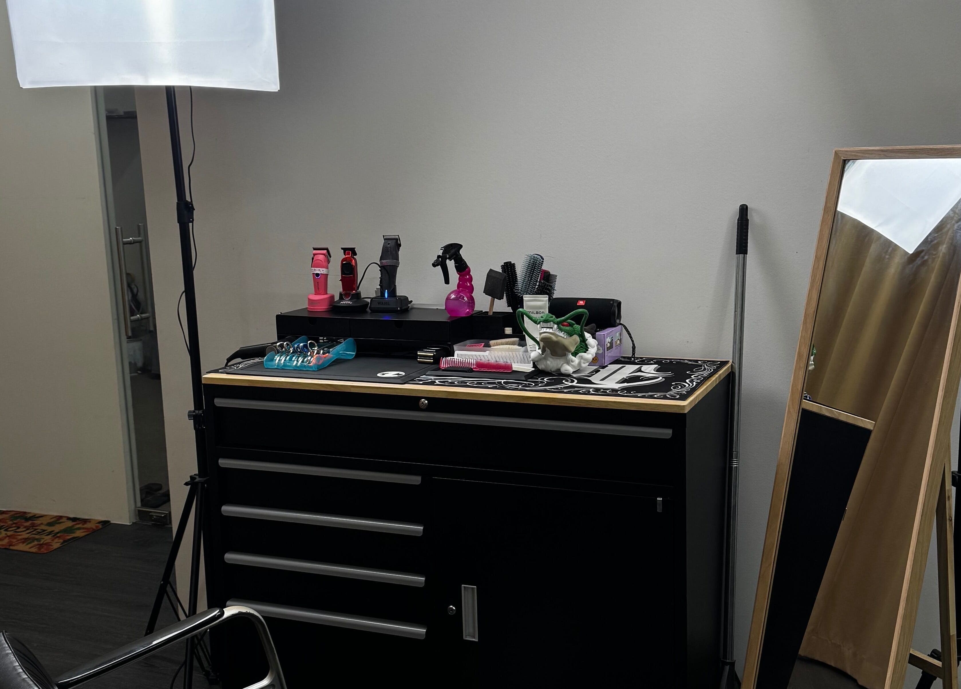 Rascals hair styling station in Singapore, Singapore, SG, featuring tools and a mirror for hair services.