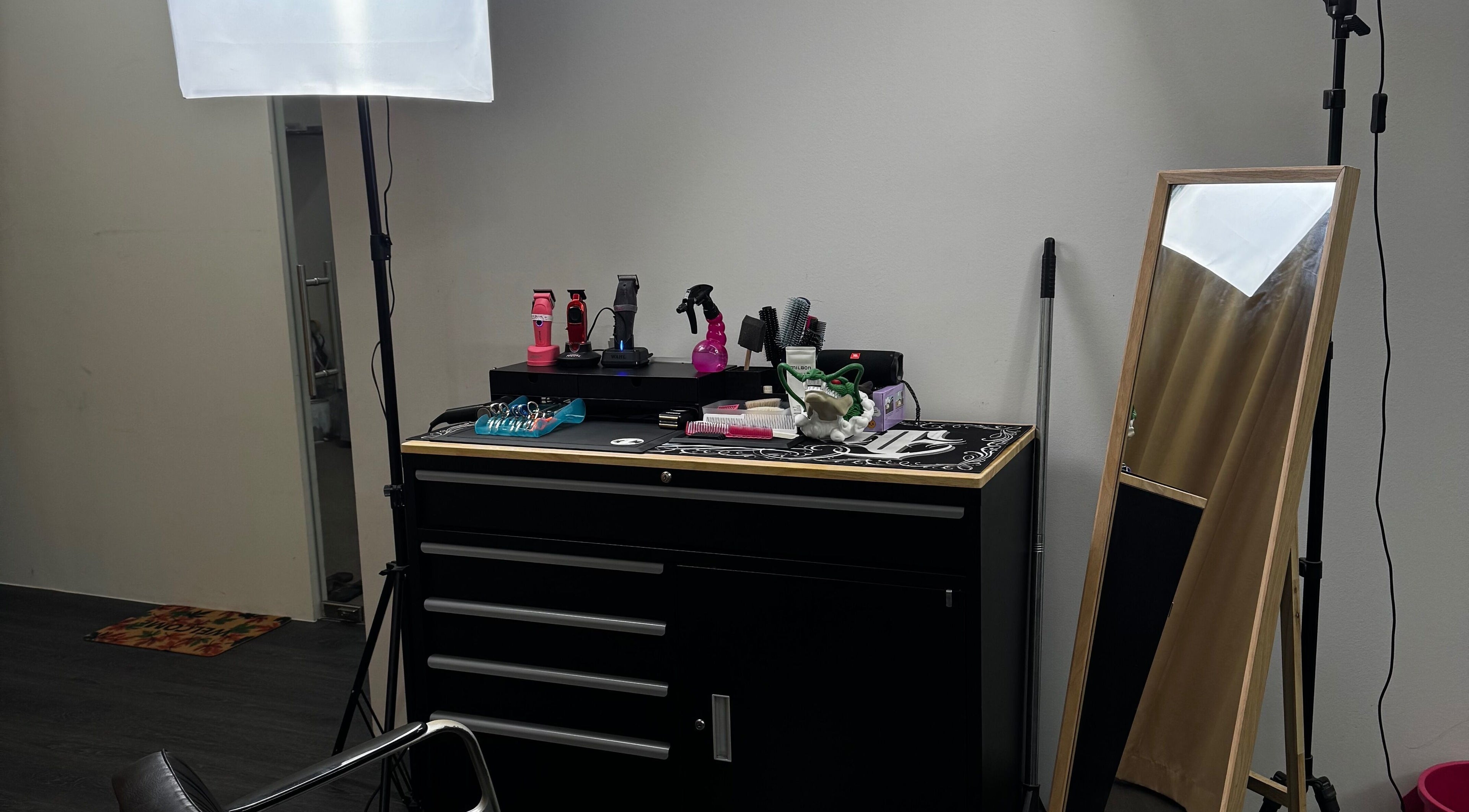 Rascals hair styling station in Singapore, Singapore, SG, featuring tools and a mirror for hair services.