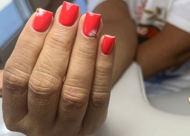 Bright red manicure at Shashi Nails in Willemstad, Curaçao, CW with elegant nail art detail.