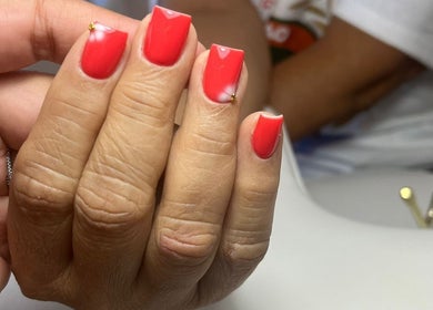 Vibrant red manicure at Shashi Nails, Willemstad, Curaçao, CW offering expert nail care.