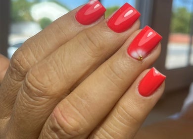 Elegant red manicure at Shashi Nails, Willemstad, Curaçao, CW. Perfect blend of style and precision.