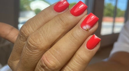 Elegant red manicure at Shashi Nails, Willemstad, Curaçao, CW. Perfect blend of style and precision.
