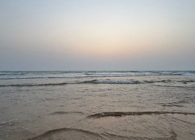 Sunset over calm beach near SS Nail salon, Nahf, North District, IL.