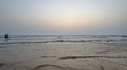 Sunset over calm beach near SS Nail salon, Nahf, North District, IL.