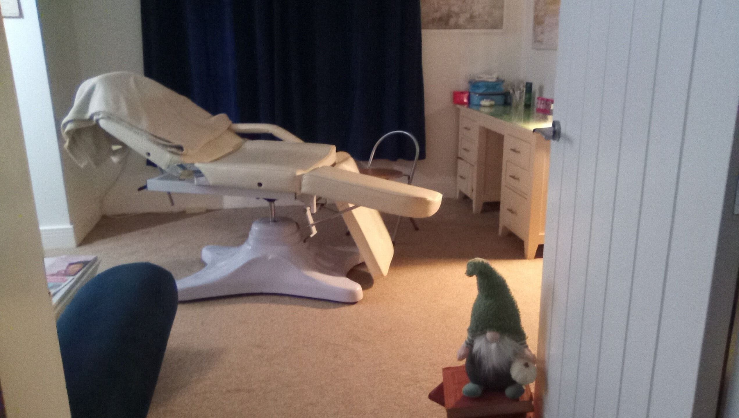 Cozy treatment room at Beauty and Care, Middlesbrough, England, GB with reclining chair and decor.