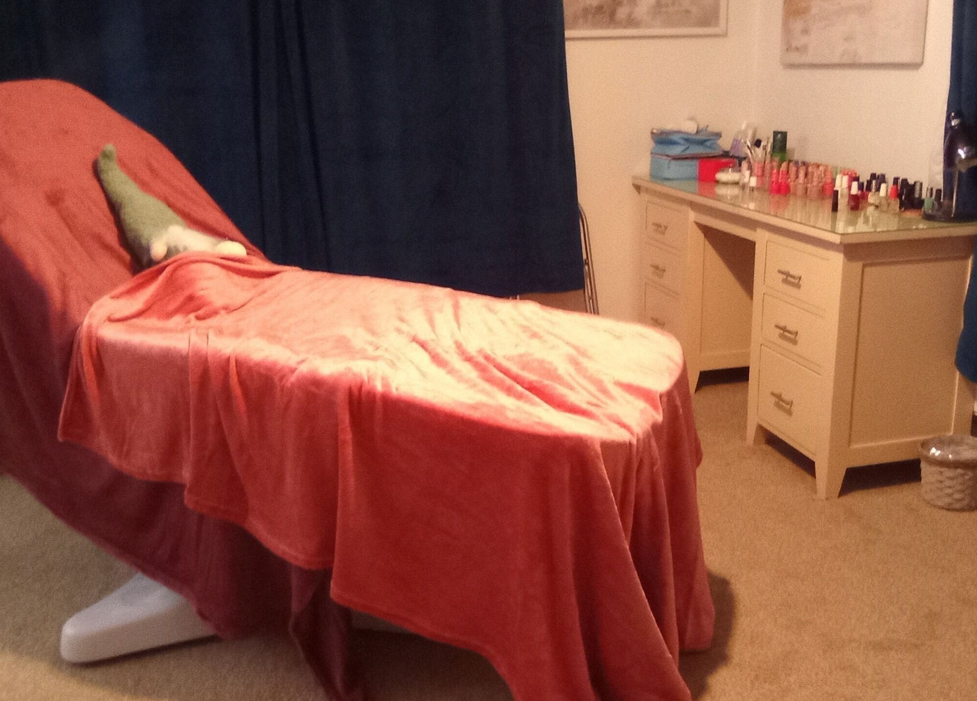 Relaxing spa room at Beauty and Care, Middlesbrough, England, GB with cozy treatment bed and nail products.