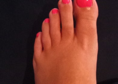 Vibrant pink pedicure at Beauty and Care in Middlesbrough, England, GB.