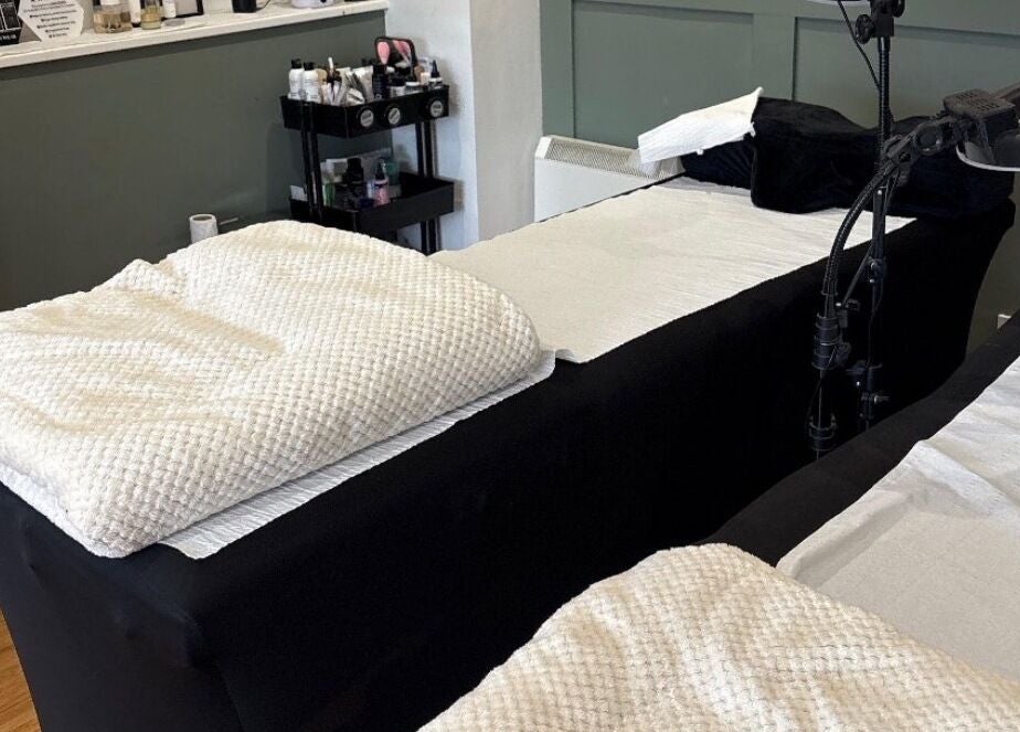 Comfortable spa treatments at Lucky Eleven, Whitburn, Scotland, GB with plush massage beds in tranquil setting.