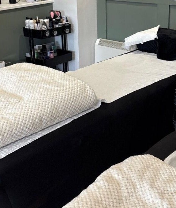 Comfortable spa treatments at Lucky Eleven, Whitburn, Scotland, GB with plush massage beds in tranquil setting.