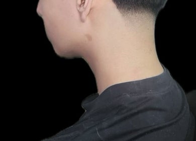 Sleek taper haircut at a_taperz in London, England, GB, showcasing expert grooming and style.
