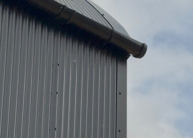 Modern tin roof detail at Calmia Treatments, Stamford, England, GB, showcasing industrial beauty.
