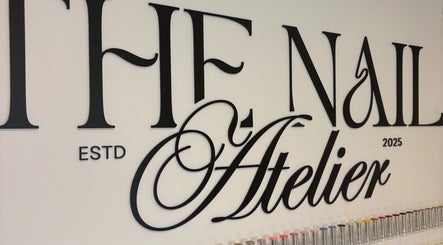 Elegant 'The Nail Atelier Co.' sign with colorful nail polishes, Chelmsford, England, GB.