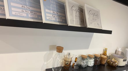 Certificates displayed at The Nail Atelier Co., Chelmsford, England, showcasing salon expertise.