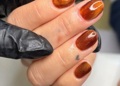 Copper shimmer nails at The Nail Atelier Co., Chelmsford, England, GB. Elegant and polished nail art.