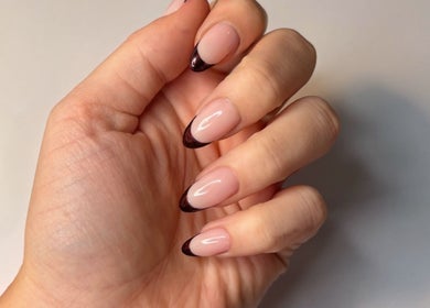 Stylish nail art with black tips at The Nail Atelier Co., Chelmsford, England, GB.