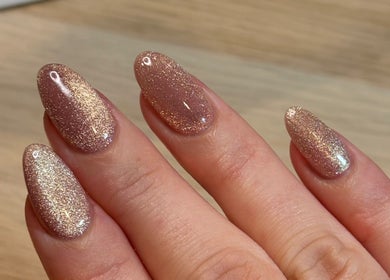 Shimmery rose gold nails at Refined. By Holly, Chelmsford, England, GB. Perfect manicure for a dazzling look.