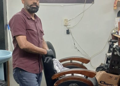 Barber at Bal Da Barber in Suva, Central Division, FJ preparing tools in a stylish salon.