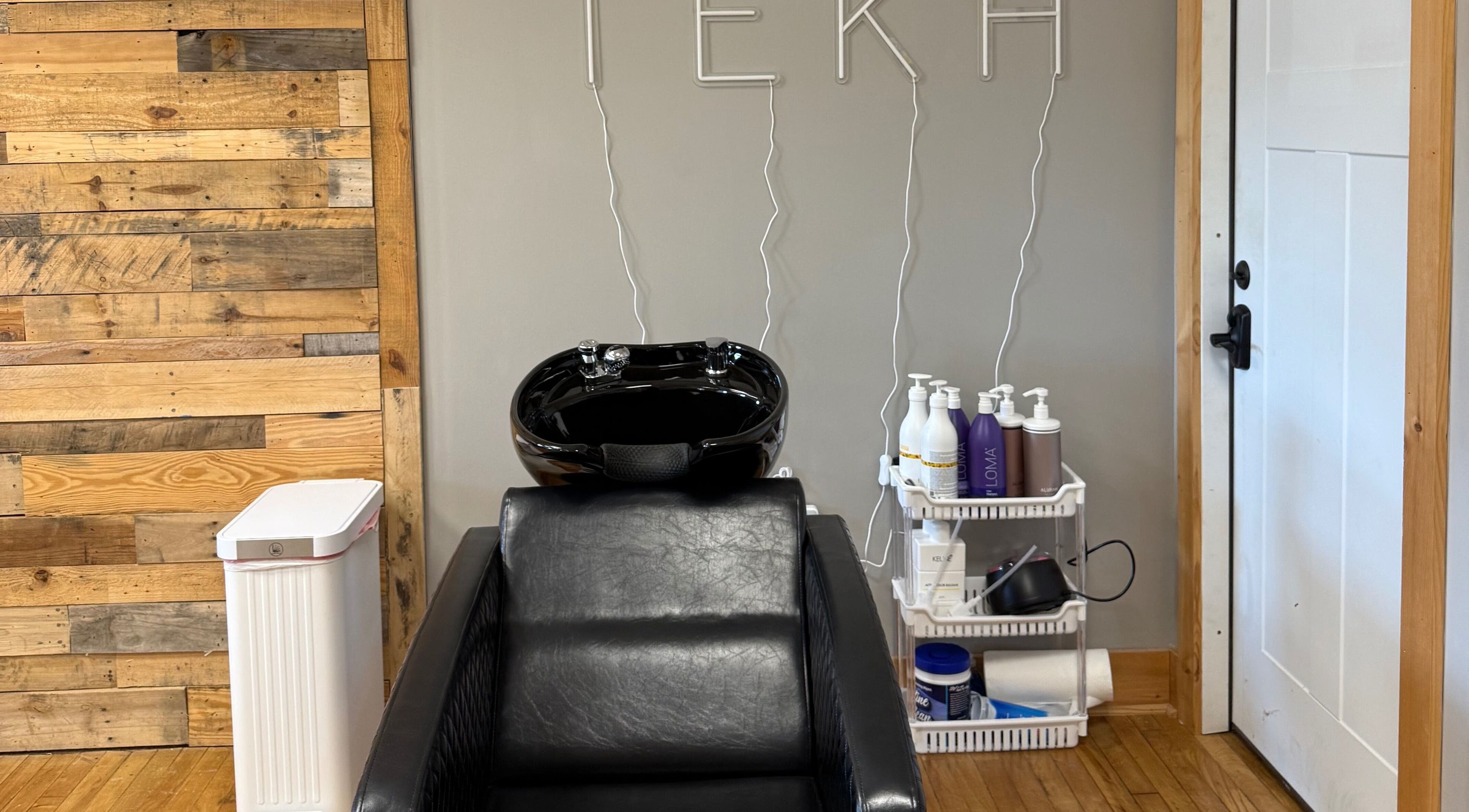 Tekh Hair Studio LLC wash station at Hilton, New York, US with modern styling and organic products.