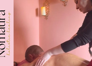 Relaxing massage therapy at Nomaura in Pontypool, Wales, GB with warm candlelit ambiance.