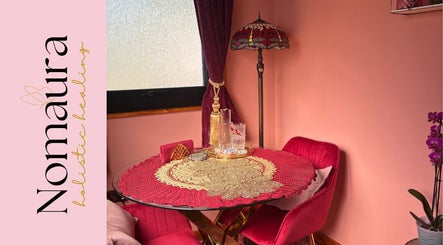 Nomaura's elegant interior with red decor and vintage lamp in Pontypool, Wales, GB.