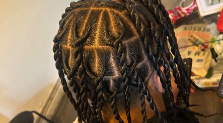 Intricate braided hairstyle at Hairbyreshi, Wolverhampton, England, GB showcasing unique design.