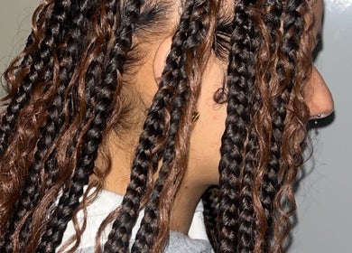 Intricate braided hair styled at Hairbyreshi in Wolverhampton, England, GB showcasing expert craftsmanship.