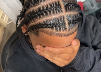 Intricate braided hairstyle at Hairbyreshi, Wolverhampton, England, GB.
