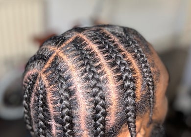Neatly braided hair at Hairbyreshi, Wolverhampton, England, GB showcasing intricate style.