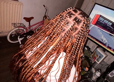 Intricate braided hairstyle at Hairbyreshi, Wolverhampton, England, GB, showcasing detailed hair artistry.