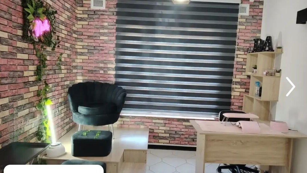 Trendy interior of Nonny Tips & Toes Nail Bar in Queensburgh, Kwazulu-natal, ZA showcasing stylish seating and decor.