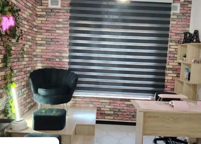 Trendy interior of Nonny Tips & Toes Nail Bar in Queensburgh, Kwazulu-natal, ZA showcasing stylish seating and decor.