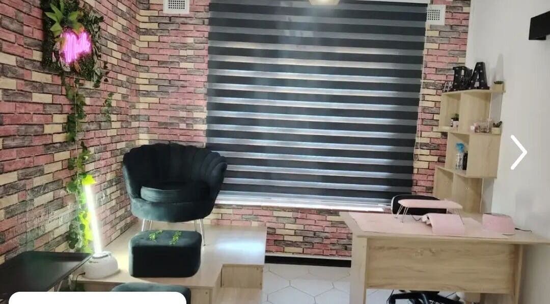 Trendy interior of Nonny Tips & Toes Nail Bar in Queensburgh, Kwazulu-natal, ZA showcasing stylish seating and decor.