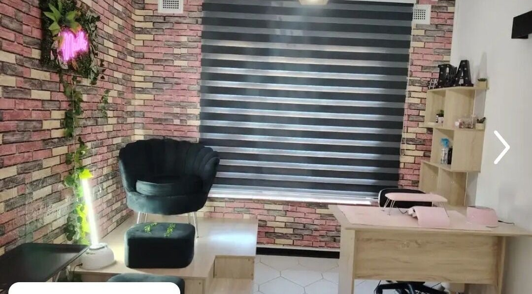 Trendy interior of Nonny Tips & Toes Nail Bar in Queensburgh, Kwazulu-natal, ZA showcasing stylish seating and decor.