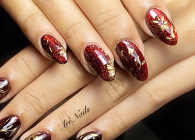 Elegant red glitter nails with floral design at Ari Nails, Talisay, Central Visayas, PH.