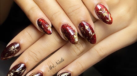 Elegant red glitter nails with floral design at Ari Nails, Talisay, Central Visayas, PH.