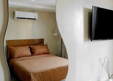 Cozy room with earthy tones at Ari Nails, Talisay, Central Visayas, PH, featuring modern amenities for relaxation.