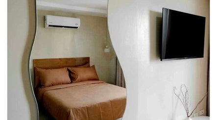 Cozy room with earthy tones at Ari Nails, Talisay, Central Visayas, PH, featuring modern amenities for relaxation.