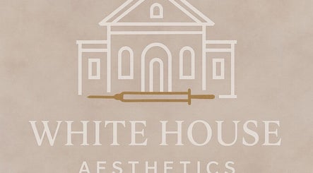 White House Aesthetic's logo showcasing elegant facade design in Tring, England, GB.