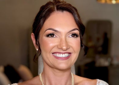 Smiling bride with elegant makeup by Beth Ritchie Makeup Artist in Peebles, Scotland, GB.