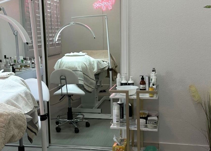Modern treatment room at DN skin health, Las Vegas, Nevada, US featuring skincare products and cozy setup.