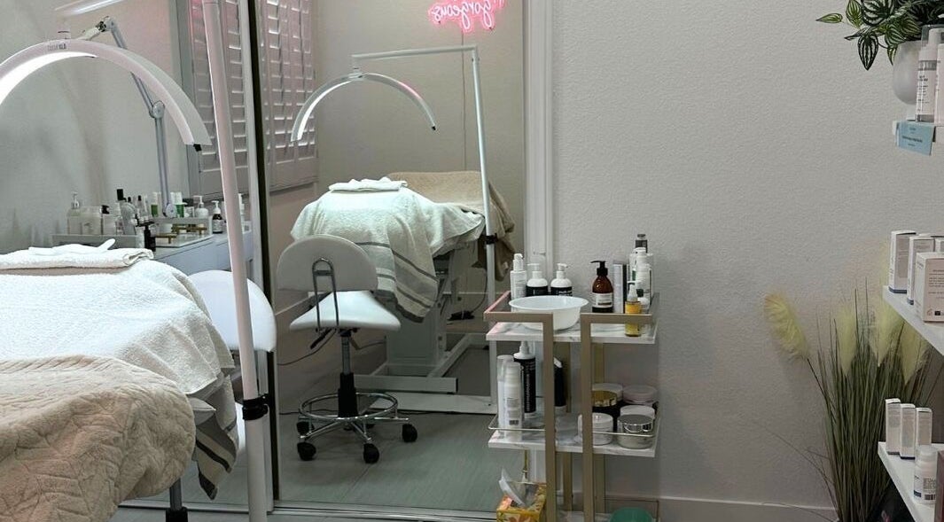 Modern treatment room at DN skin health, Las Vegas, Nevada, US featuring skincare products and cozy setup.