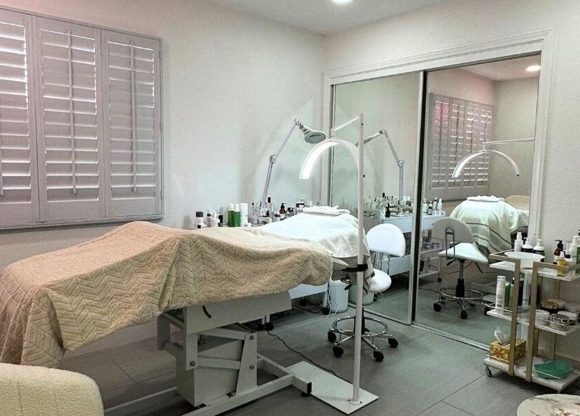 Comfortable treatment room at DN skin health in Las Vegas, Nevada, US, featuring spa bed and beauty equipment.