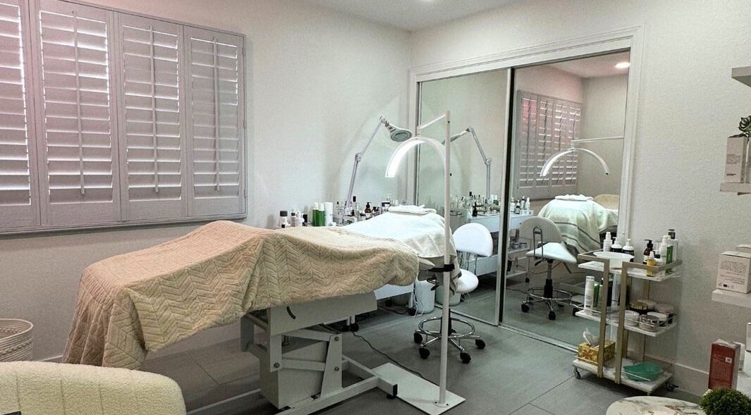 Comfortable treatment room at DN skin health in Las Vegas, Nevada, US, featuring spa bed and beauty equipment.