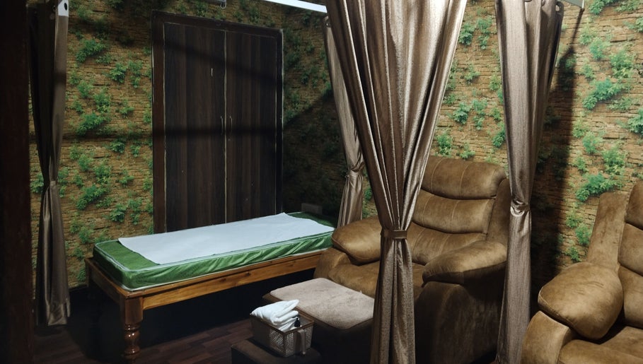 Relaxing interior of Footvarma, Chennai, Tamil Nadu, IN showcasing luxurious massage chairs and serene decor.